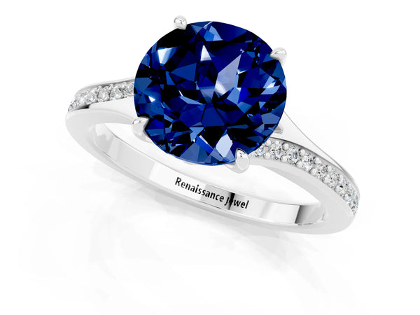 Silver Round Cut Blue Sapphire Solitaire Ring with Pavé Band and Prong Setting
