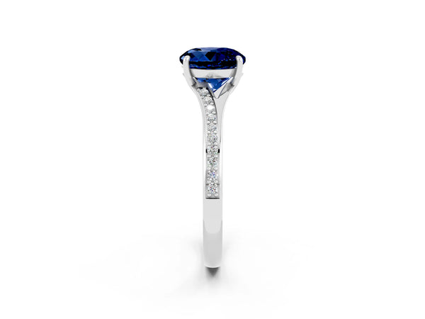Silver Round Cut Blue Sapphire Solitaire Ring with Pavé Band and Prong Setting