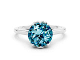 Silver Round Cut Blue Topaz Solitaire Ring with Flower Prong Setting and Classic Band