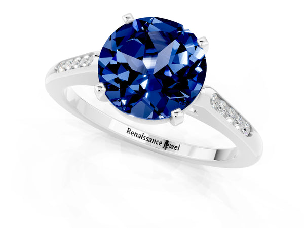 Silver Round Cut Blue Sapphire Solitaire Ring with Channel Set Round Band and Prong Setting