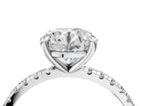 Silver Round Cut Diamond Brilliant Solitaire Ring with Pavé Band and Four-Prong Setting_311