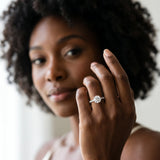 Silver Round Cut Diamond Brilliant Solitaire Ring with Pavé Band and Four-Prong Setting