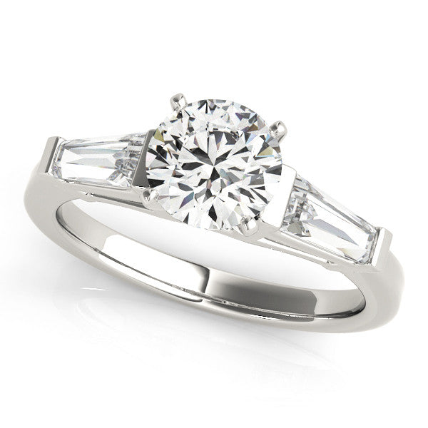 Silver Round Cut Diamond Solitaire Ring with Tapered Baguette Accents and Four-Prong Setting 1