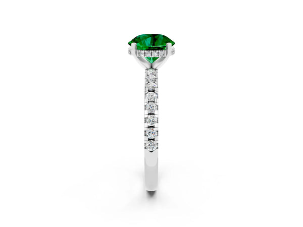 Silver Round Cut Emerald Solitaire Ring with Round Pavé Band and Four-Prong Setting