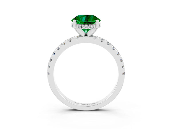 Silver Round Cut Emerald Solitaire Ring with Round Pavé Band and Four-Prong Setting