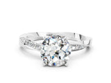 Silver Round Cut Moissanite Engagement Ring with Side Stone Accents and Four-Prong Setting_24