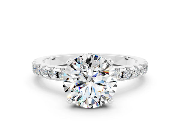 Silver Round Cut Moissanite Solitaire Ring with Round Pavé Band and Four-Prong Setting
