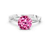 Silver Round Cut Pink Sapphire Engagement Ring with Side Stone Accents and Four-Prong Setting_12
