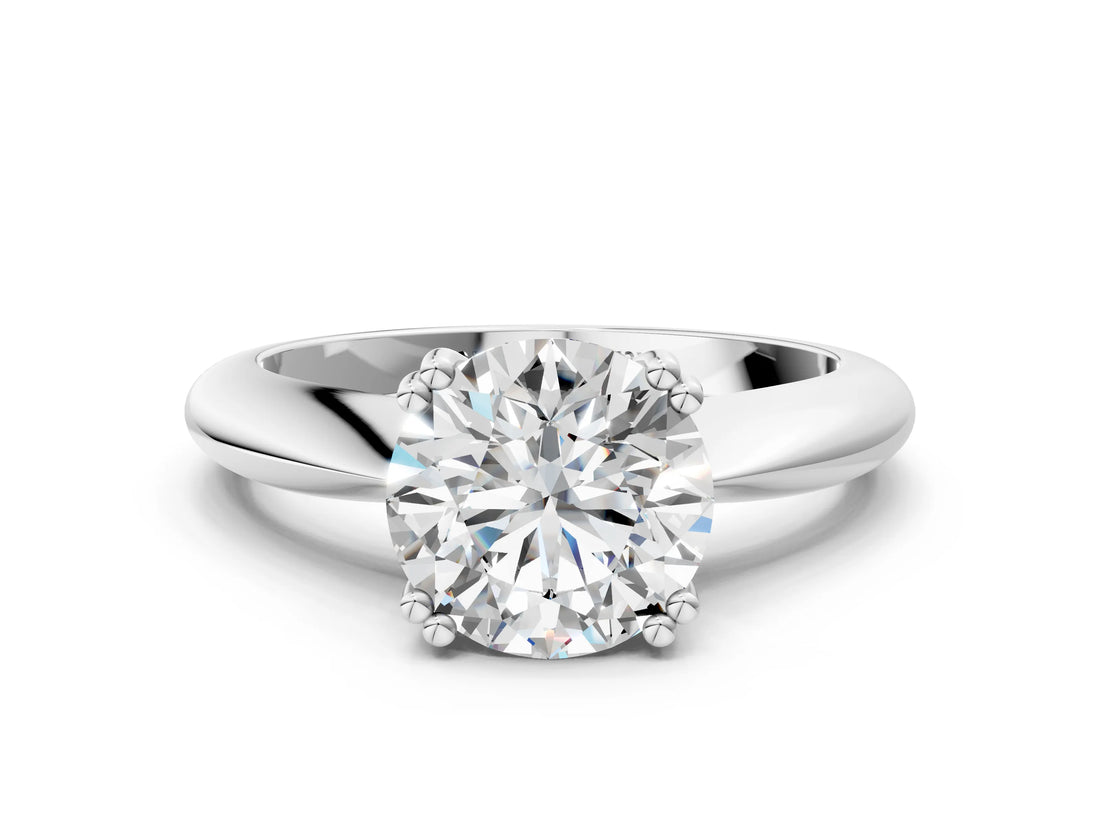Silver Round Cut Solitaire Engagement Ring with Tapered Band and Four-Prong Setting