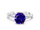 Silver Round Cut Tanzanite Engagement Ring with Side Stone Accents and Four-Prong Setting_12