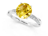 Silver Round Cut Yellow Sapphire Engagement Ring with Side Stone Accents and Four-Prong Setting_25