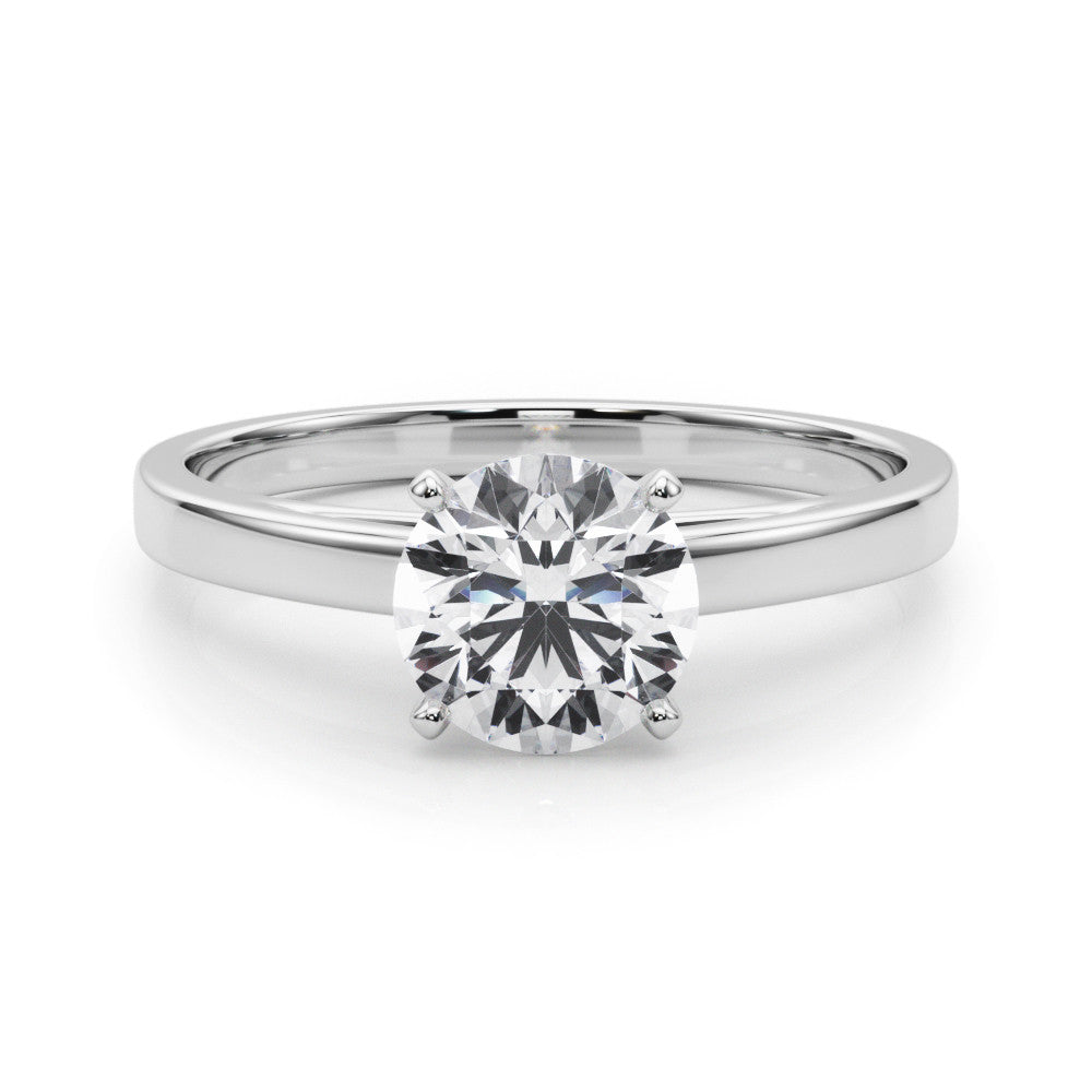 Silver Round Solitaire Diamond Engagement Ring with Four-Prong Setting on a Classic Band