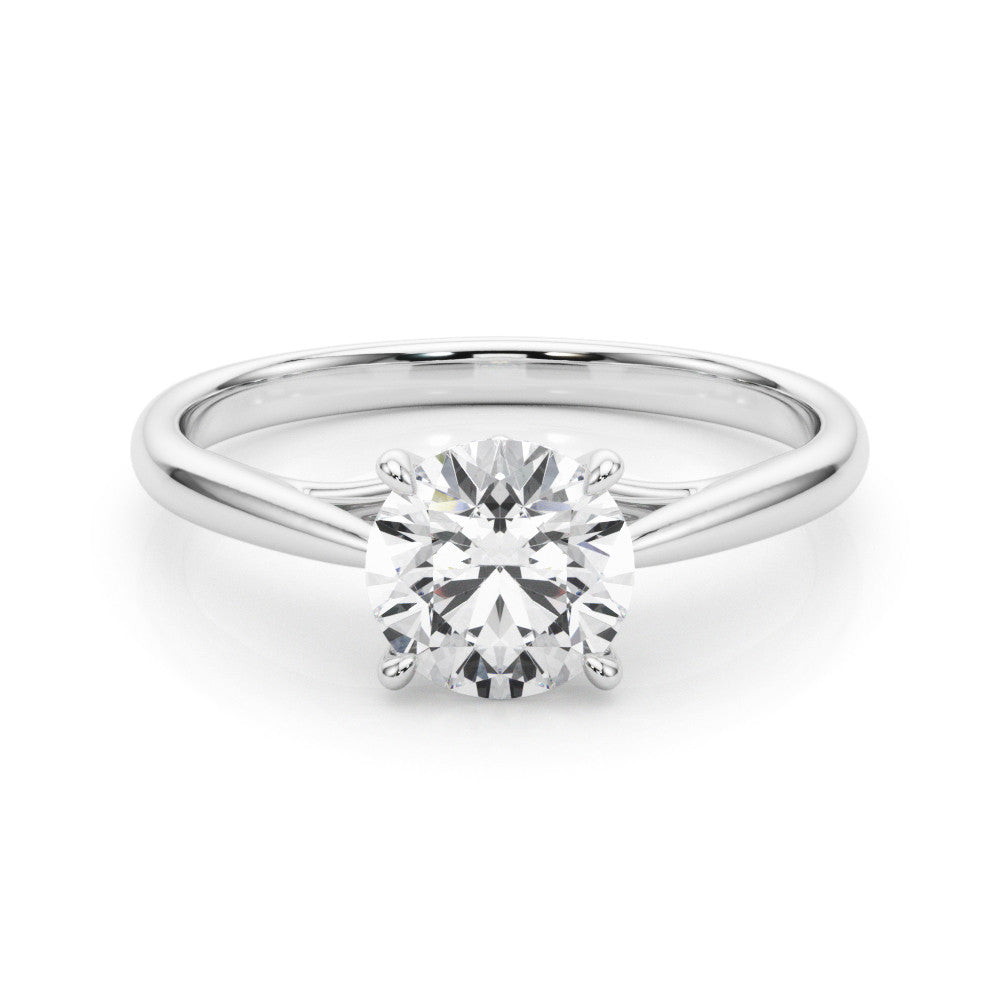 Silver Round Solitaire Engagement Ring with Four-Prong Setting and Classic Band