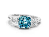 Silver Three-Stone Cushion Cut Blue Topaz Ring with Pear  Side Stones in Four-Prong Setting_54