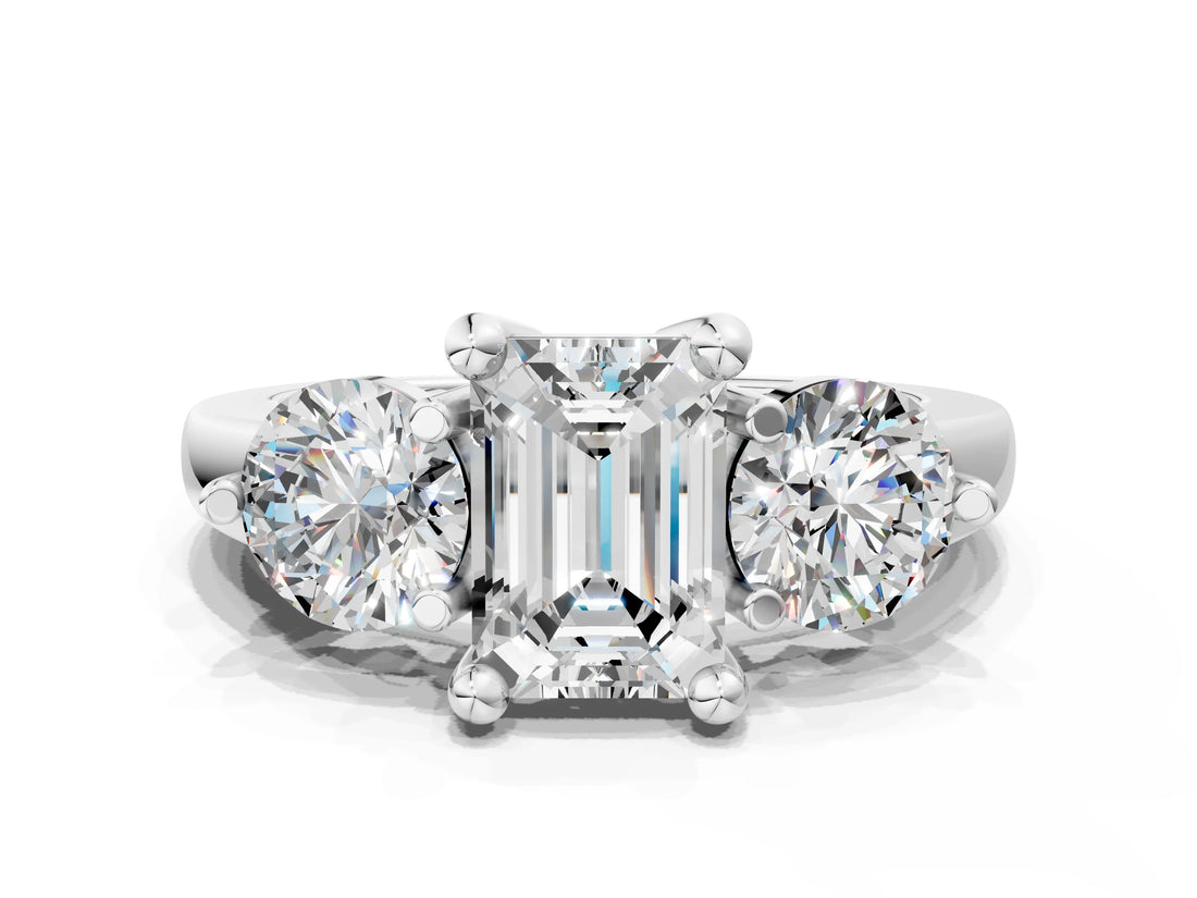 Silver Three-Stone Emerald Brilliant Cut Solitaire Ring with Prong Setting on a Classic Band