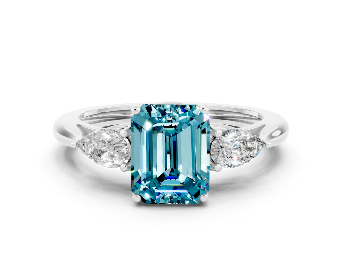 Silver Three-Stone Emerald Cut Blue Topaz Ring with Pear  Side Stones in Four-Prong Setting_54