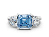 Silver Three-Stone Fancy Blue Asscher  Brilliant Cut Solitaire Ring with Prong Setting on a Classic Band