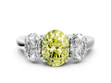 Silver Three-Stone Fancy Yellow Oval Cut Cut Diamond Ring with Channel Set Band and Four-Prong Setting_19