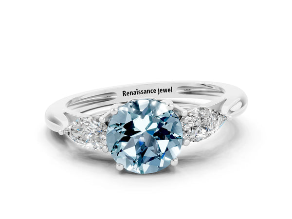 Silver Three-Stone Round Cut Aquamarine Ring with Pear  Side Stones in Four-Prong Setting