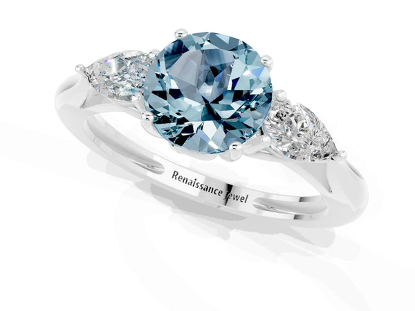 Silver Three-Stone Round Cut Aquamarine Ring with Pear  Side Stones in Four-Prong Setting