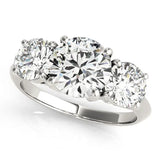 Silver Three-Stone Round Cut Diamond Engagement Ring with Prong Setting on a Silver Band