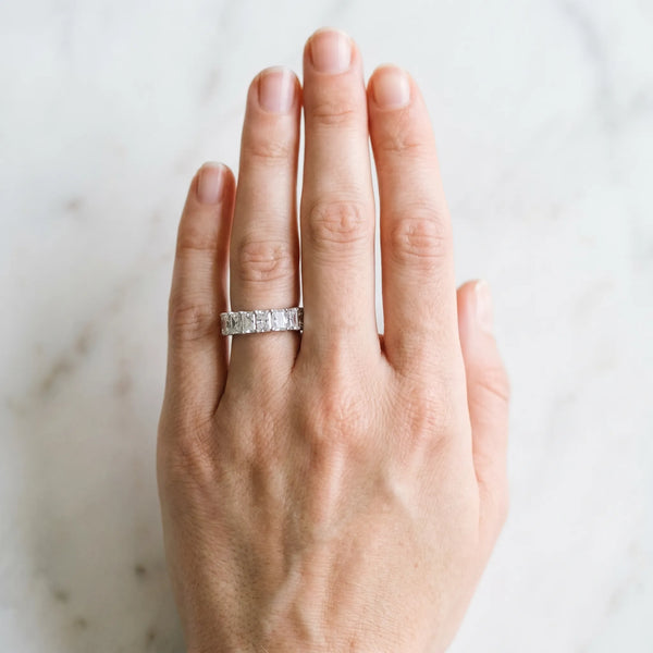 Platinum radiant cut diamond half eternity band with shared prong setting