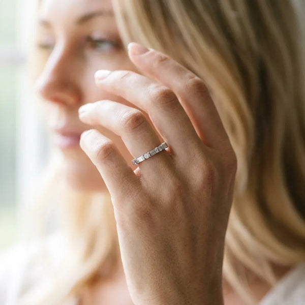 Platinum Baguette and Round Diamond Channel Set Half Eternity Band with Bar Prong Setting