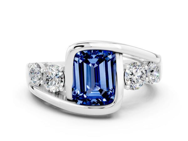 Platinum Bezel Set Emerald Cut Blue Sapphire Bypass Ring with Round  Accents