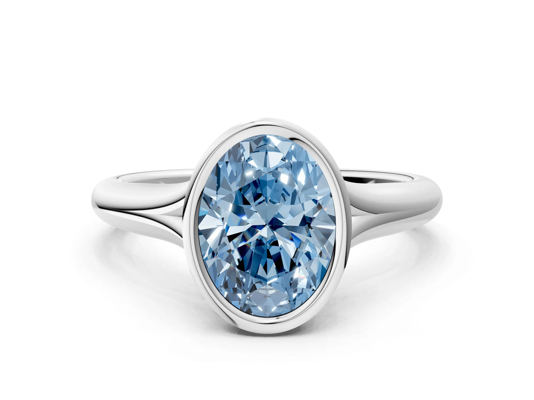 White gold Bezel Set Fancy Blue Oval  Solitaire Diamond Ring with Smooth Band