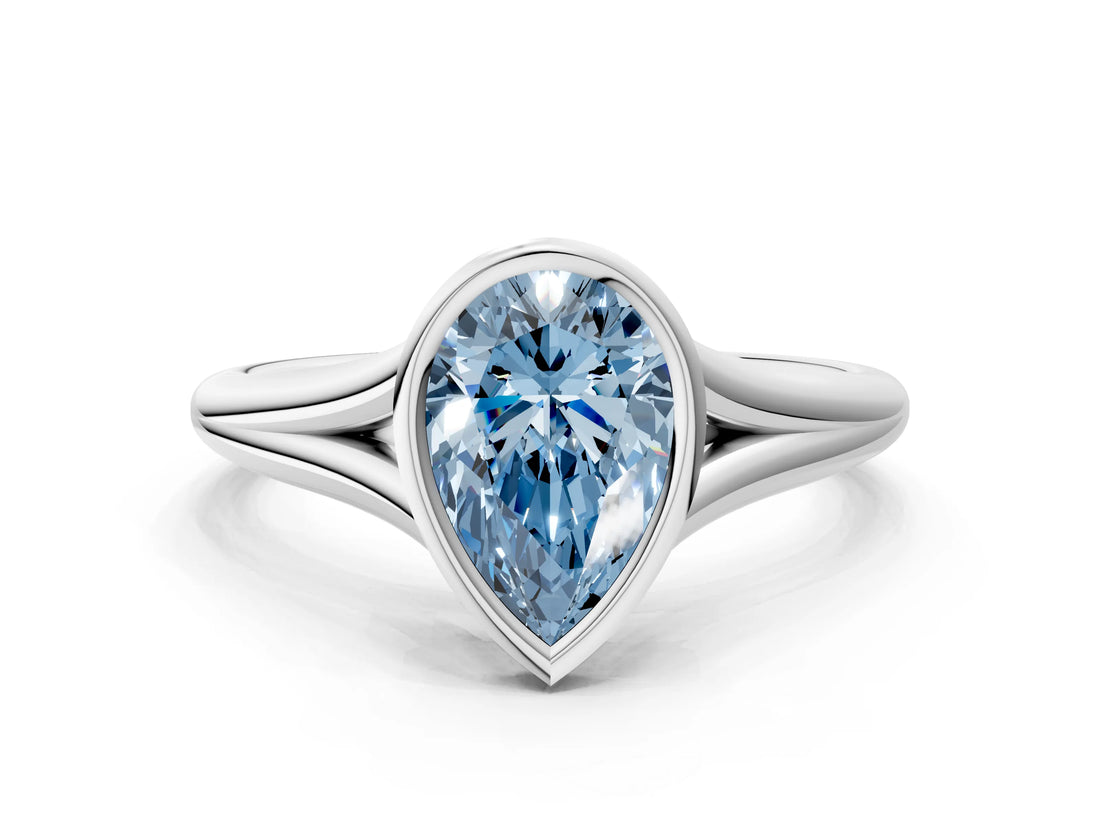 White gold Bezel Set Fancy Blue Pear  Cut Solitaire Ring with Tapered Band