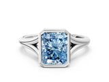 White gold Bezel Set Fancy Blue Radiant  Cut Solitaire Ring with Tapered Band
