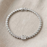 White gold Bezel-Set Round Diamond Tennis Bracelet with Radiant Center Diamond