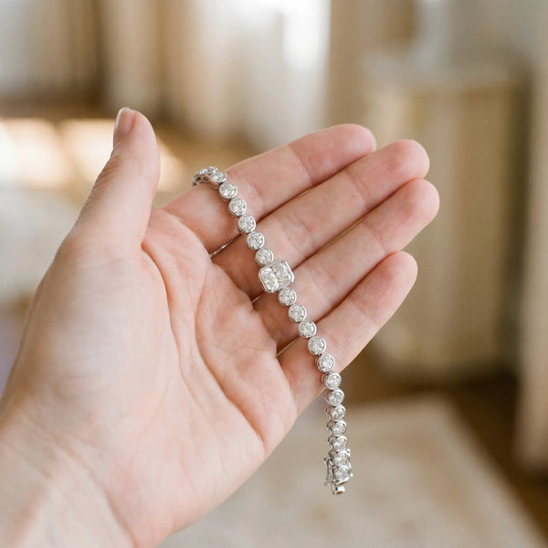 White gold Bezel-Set Round Diamond Tennis Bracelet with Radiant Center Diamond