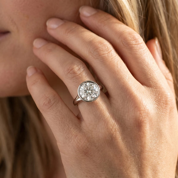 White gold Bezel Set Round Solitaire Diamond Ring with Smooth Band