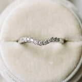 White gold Curved Diamond Wedding Band with Round Cut Stones and Shared Prong Setting_27