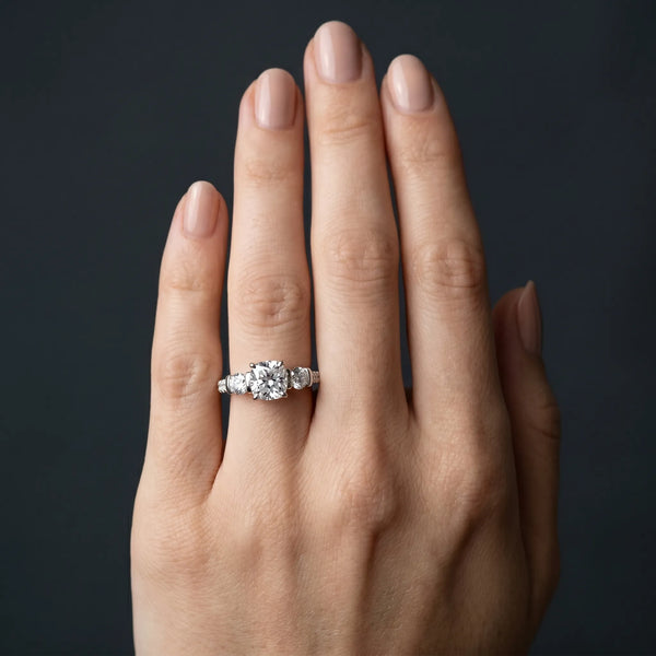 White gold Cushion Brilliant Trilogy Channel Set Diamond Ring with Bar Prongs