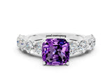 White gold Cushion Cut Amethyst Prong Setting with Side Stones on a Pave Band