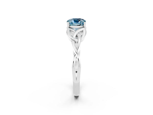 Platinum Cushion Cut Aquamarine Solitaire Engagement Ring with Celtic Knot Band and Four-Prong Setting