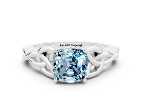 White gold Cushion Cut Aquamarine Solitaire Engagement Ring with Celtic Knot Band and Four-Prong Setting