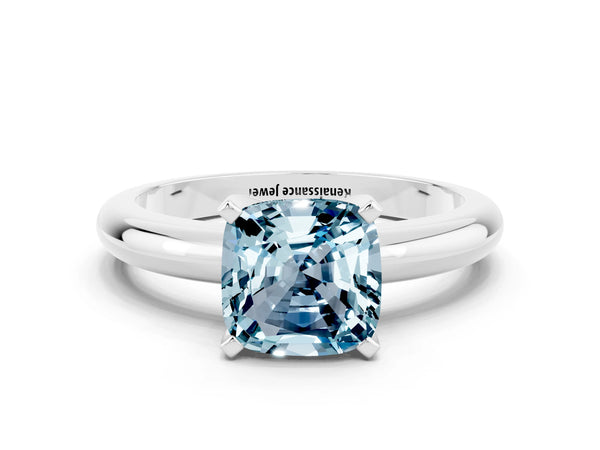 Platinum Cushion Cut Aquamarine Solitaire Engagement Ring with Round Band and Four-Prong Setting