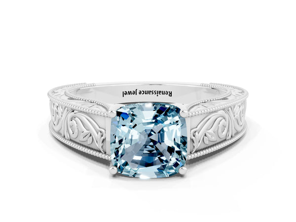 Platinum Cushion Cut Aquamarine Solitaire Ring with Engraved Band and Four-Prong Setting