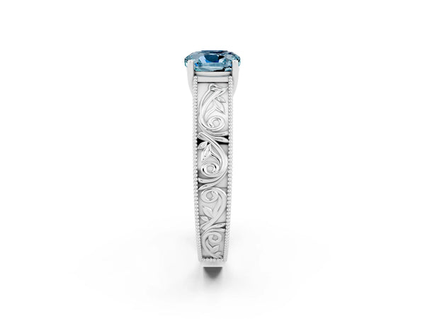 Platinum Cushion Cut Aquamarine Solitaire Ring with Engraved Band and Four-Prong Setting