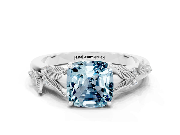 Platinum Cushion Cut Aquamarine Solitaire Ring with Leaf Motif Band and Four-Prong Setting