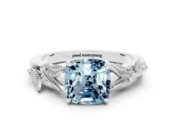 Platinum Cushion Cut Aquamarine Solitaire Ring with Leaf Motif Band and Four-Prong Setting