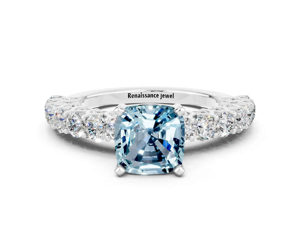 Platinum Cushion Cut Aquamarine Solitaire Ring with Shared Prong Pavé Band and Four-Prong Setting