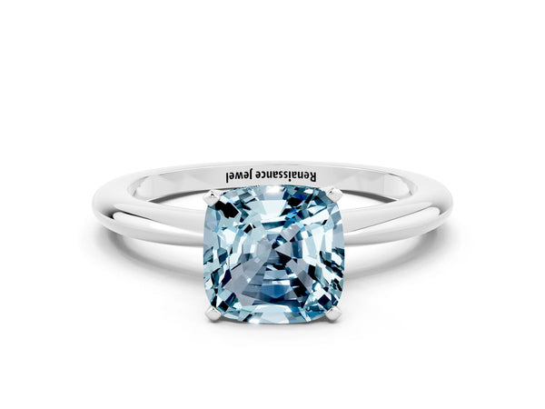 Platinum Cushion Cut Aquamarine Solitaire Ring with Six-Prong Setting and Classic Band