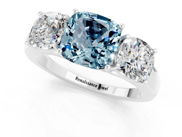 Platinum Cushion Cut Aquamarine Three-Stone Ring with Four-Prong Setting and Classic Band