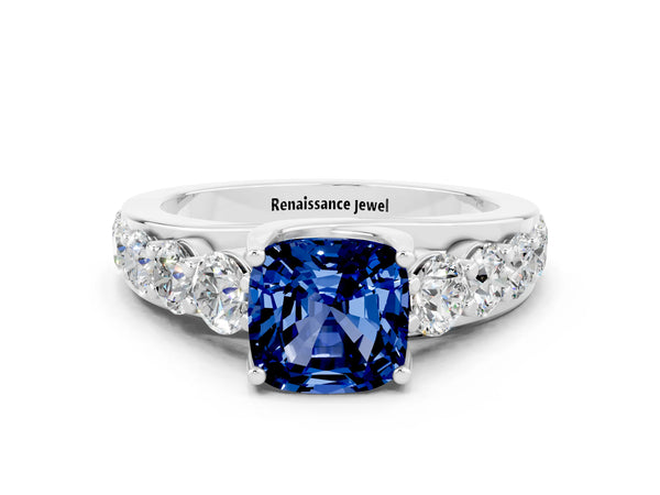 Silver Cushion Cut Blue Sapphire Engagement Ring with Pavé Band and Four-Prong Setting