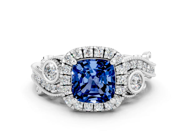 White gold Cushion Cut Blue Sapphire Halo Ring with Milgrain Pavé Band and Four-Prong Setting
