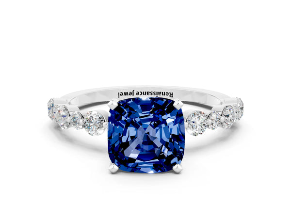 Platinum Cushion Cut Blue Sapphire Prong Set Engagement Ring with Pavé Band